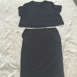 This is a black two piece crop top and skirt set for maternity size large